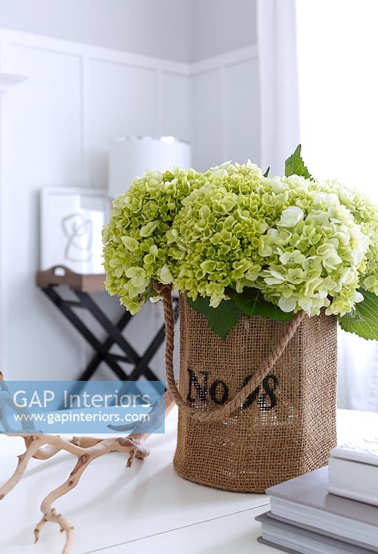 Green flowers in hessian container