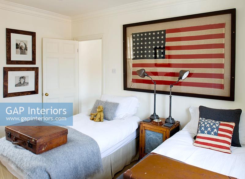Guest bedroom with framed US flag
