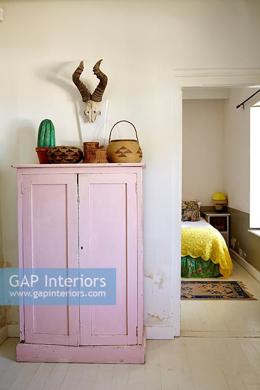 Pink cupboard in hall