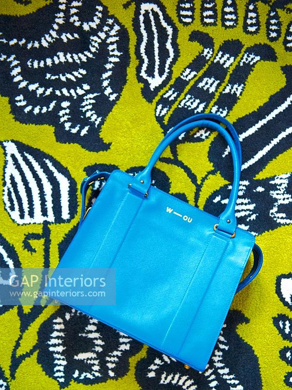 Handbag on colourful rug