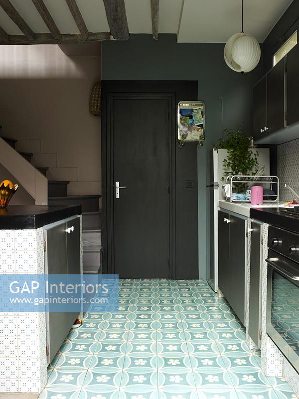 Patterned tiles on kitchen floor
