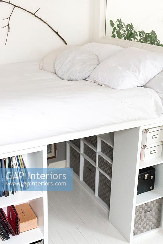 White bedroom with storage under bed