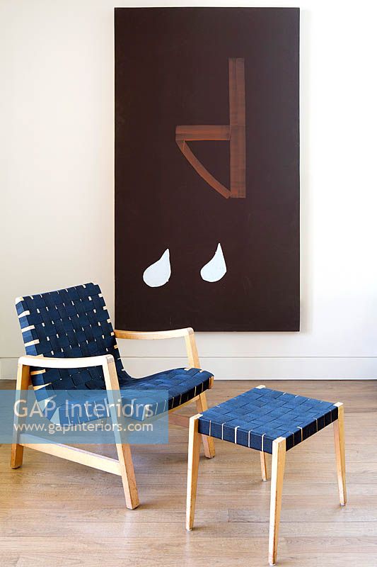 Navy blue armchair and footstool