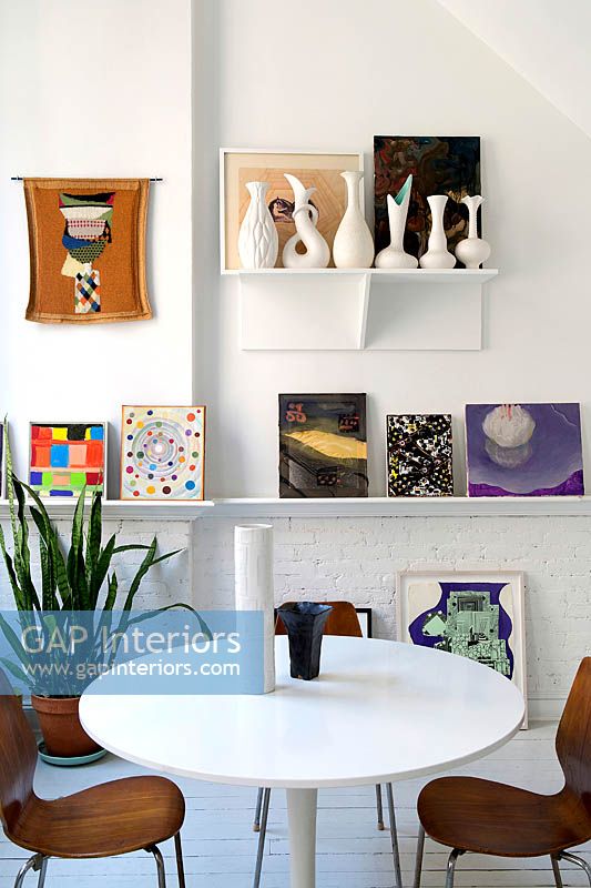Colourful art display in dining room