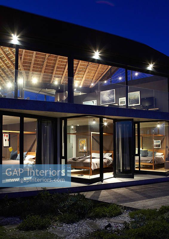 Contemporary house lit up at night
