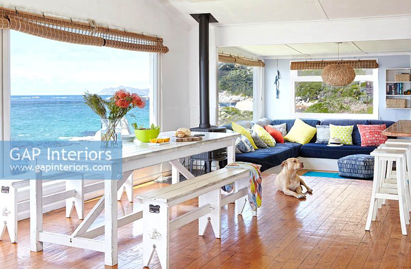 Colourful open plan dining room with sea view