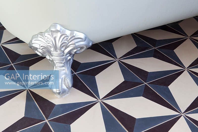 Patterned tiles and claw foot bath