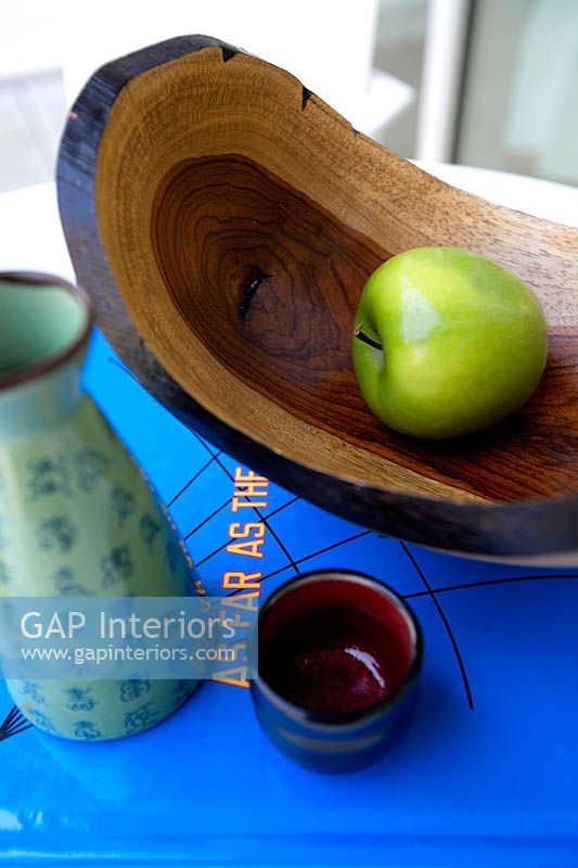 Apple in rustic wooden bowl