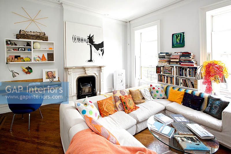 White sofa with colourful cushions