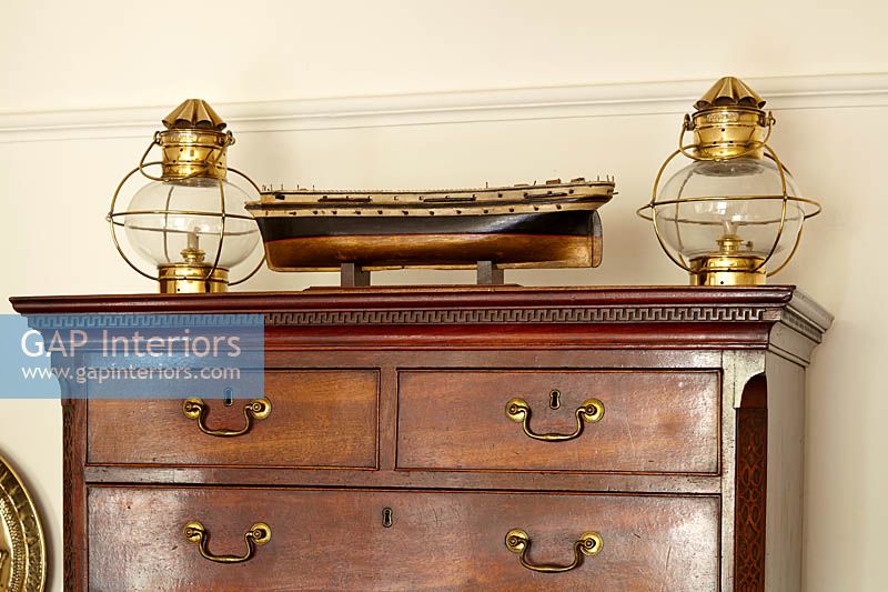 Nautical accessories on chest of drawers