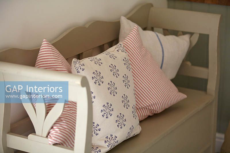 Patterned cushions on kitchen bench