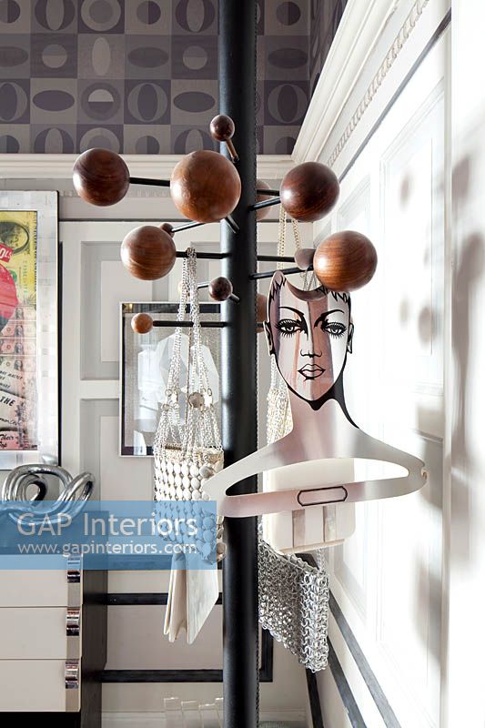 Eclectic accessories on coat hooks