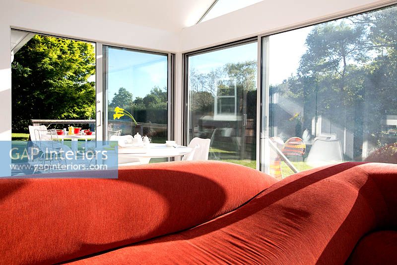 Red sofa in open plan extension