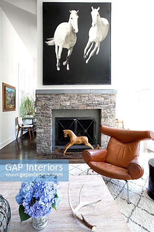 Horse painting above fireplace