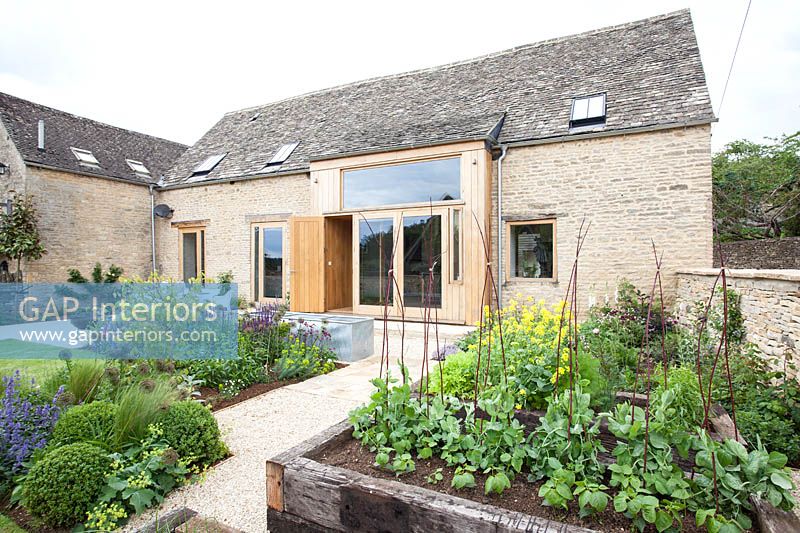 Barn conversion and garden with vegetable beds