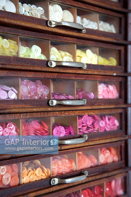 Buttons in vintage display cabinet