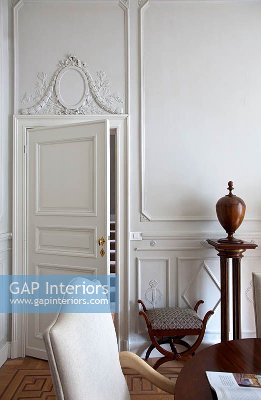 Ornate plaster mouldings above door