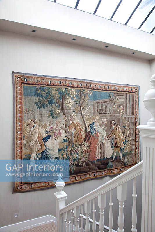 Classic tapestry on staircase wall
