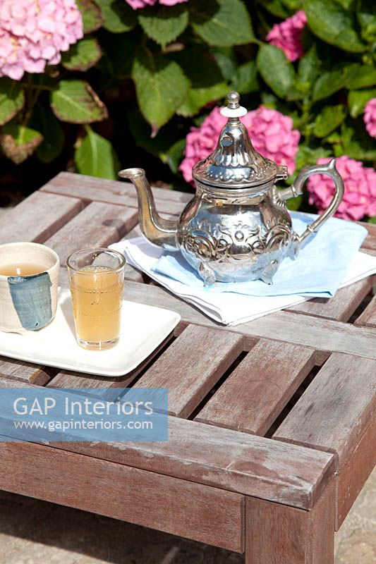 Moroccan teapot on garden table