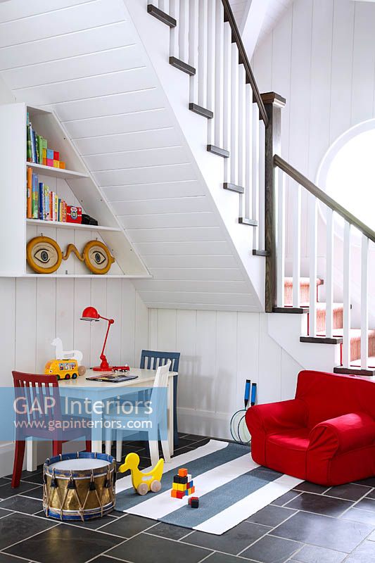 Childrens play area under stairs
