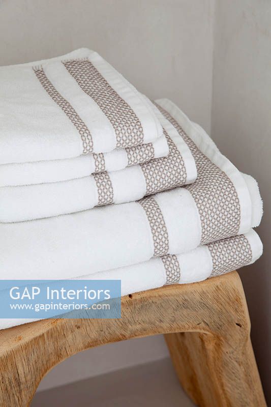 Towels on wooden stool