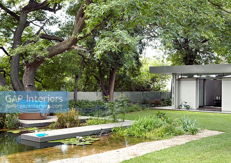 Modernist house and garden with pond