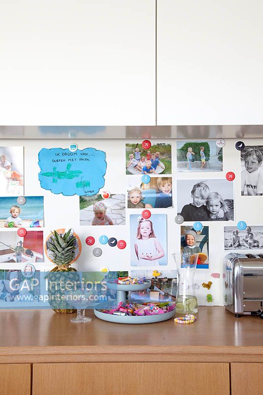 Family photo display in kitchen