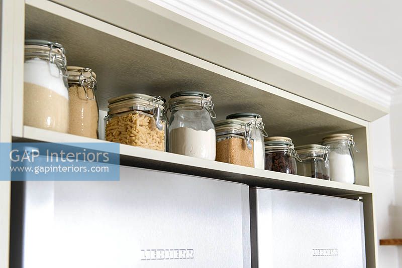 Storage jars on kitchen shelf