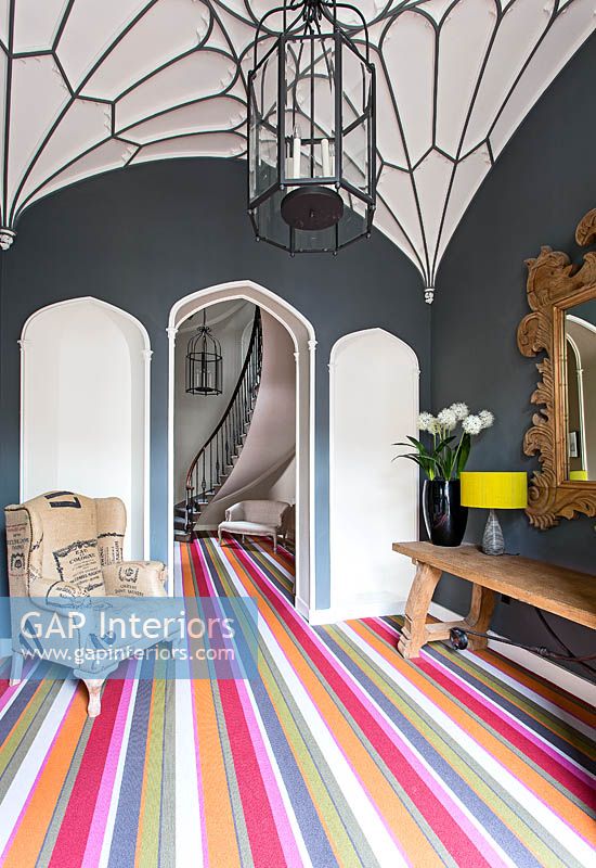 Colourful entrance hall with gothic style ceiling
