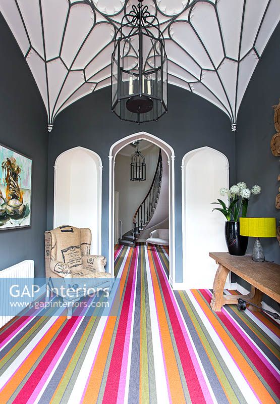 Colourful entrance hall with gothic style ceiling