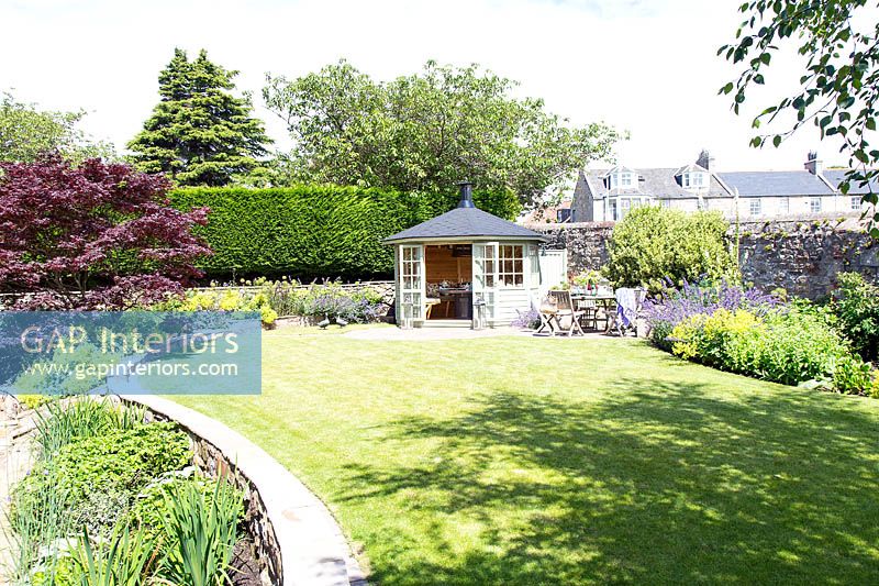 Garden with summerhouse and colourful borders