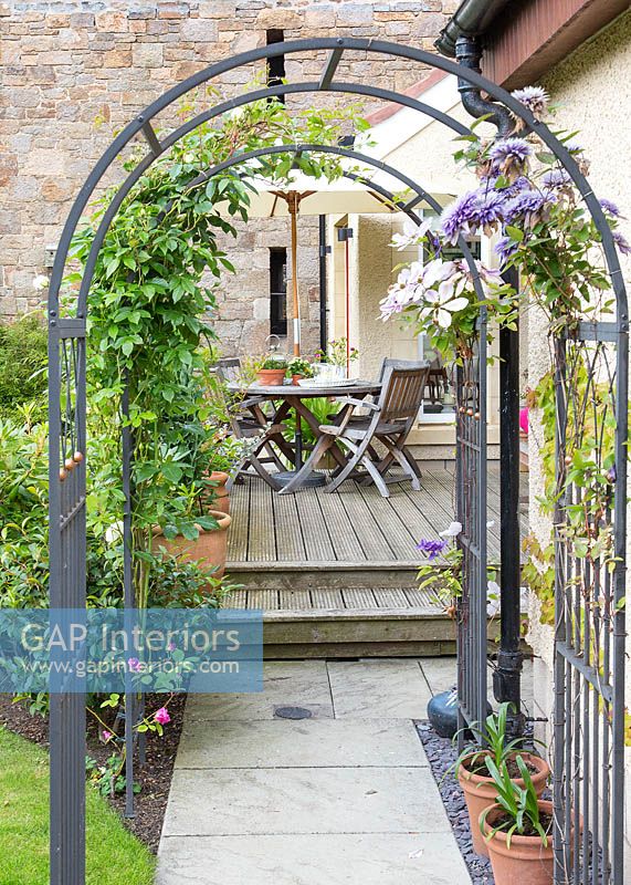 Arch with clematis growing up it