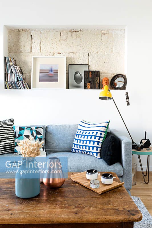 Blue sofa with storage alcove above
