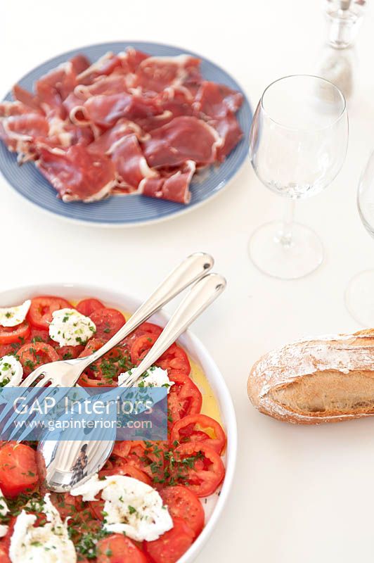 Mozzerella and tomato salad on kitchen table