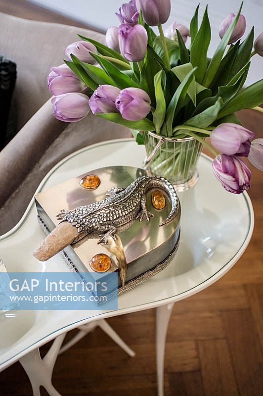 Silver accessory on white coffee table