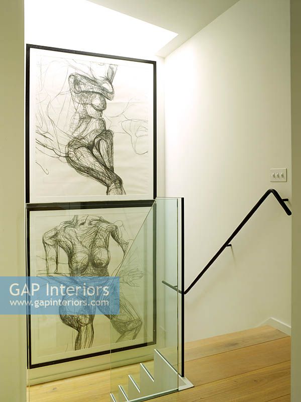 Drawings of nudes displayed on stairwell