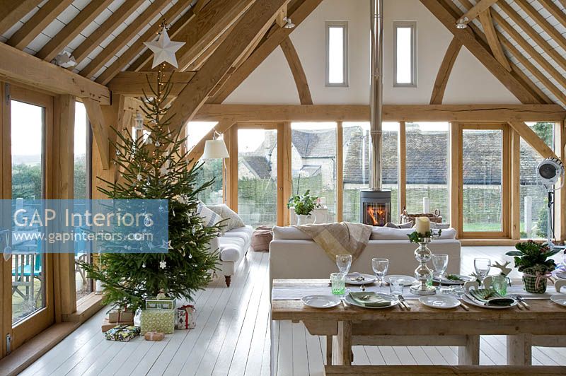 Open plan living and dining rooms decorated for christmas