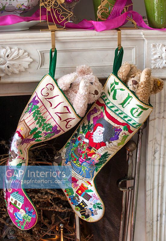 Christmas stockings hanging by fireplace