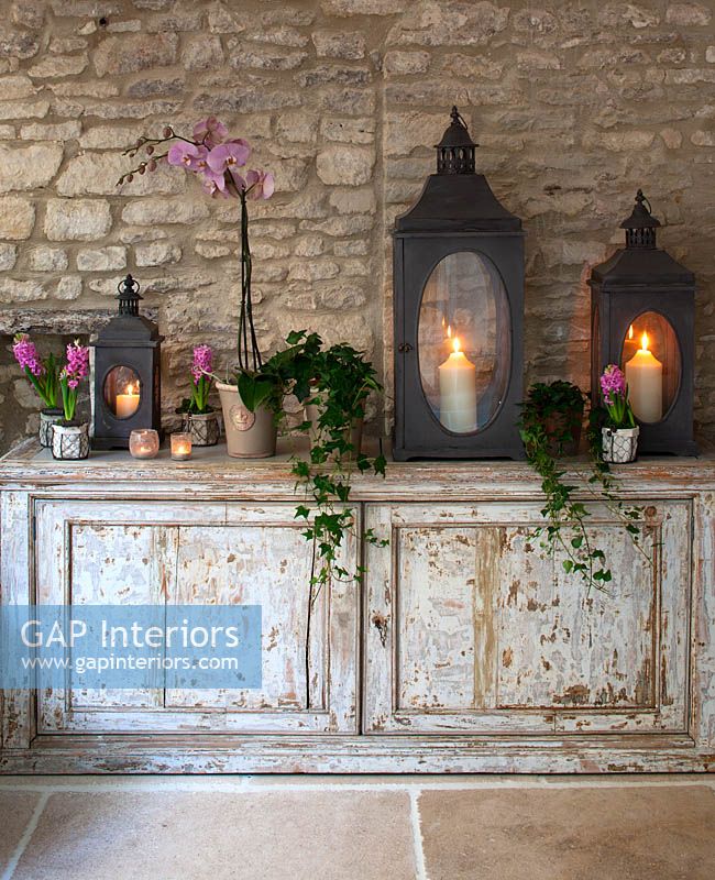 Candles on distressed cabinet