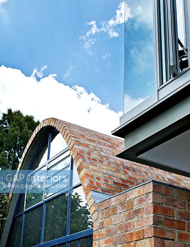 Brick cottage with modern glass extension