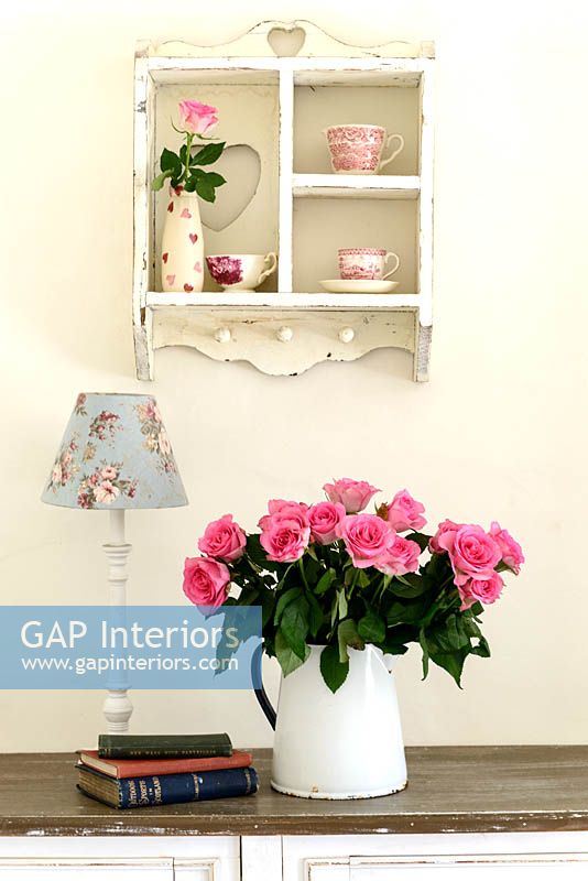 Feminine accessories on console table