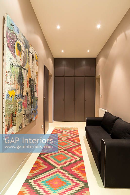 Patterned rug in corridor