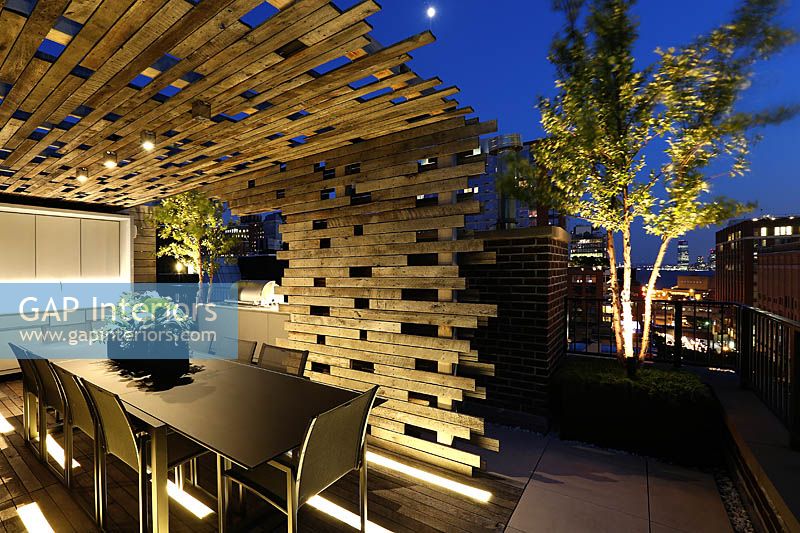 Outdoor dining area lit up at night