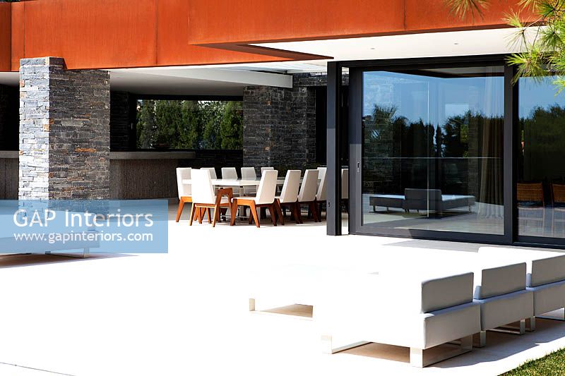 Patio area by contemporary house