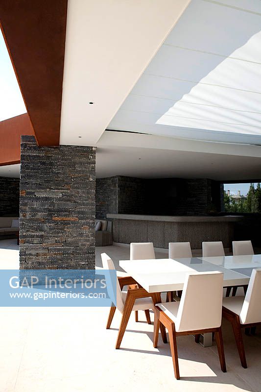 Outdoor dining area by house