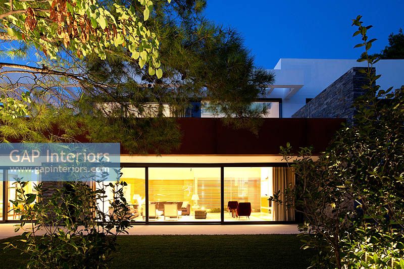 Contemporary house lit up at night