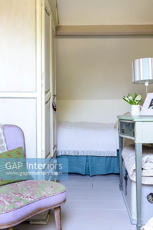 Feminine bedroom with vintage furniture