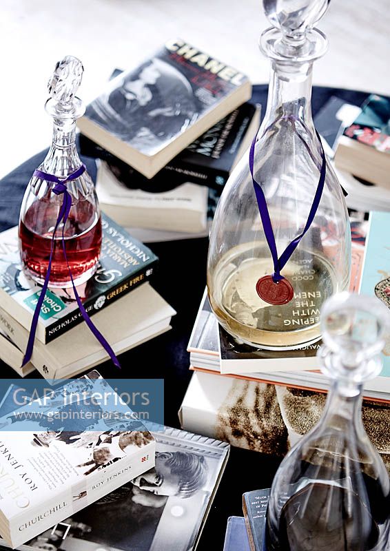 Books and decanters on coffee table