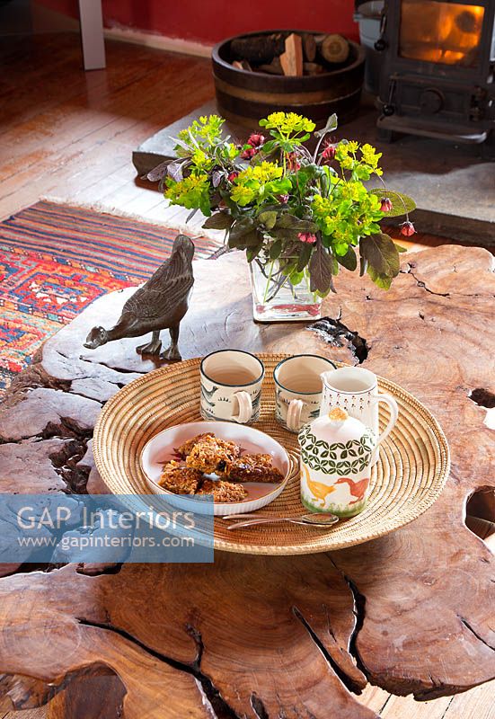 Tea and cakes on rustic wooden coffee table