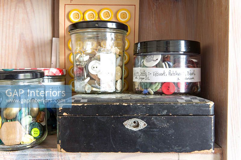 Vintage buttons stored in jars